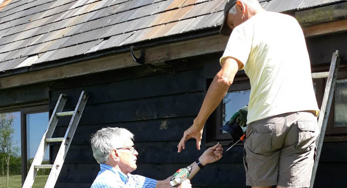 An image for Winterslow Parish Council website showing repairs being made to a roof